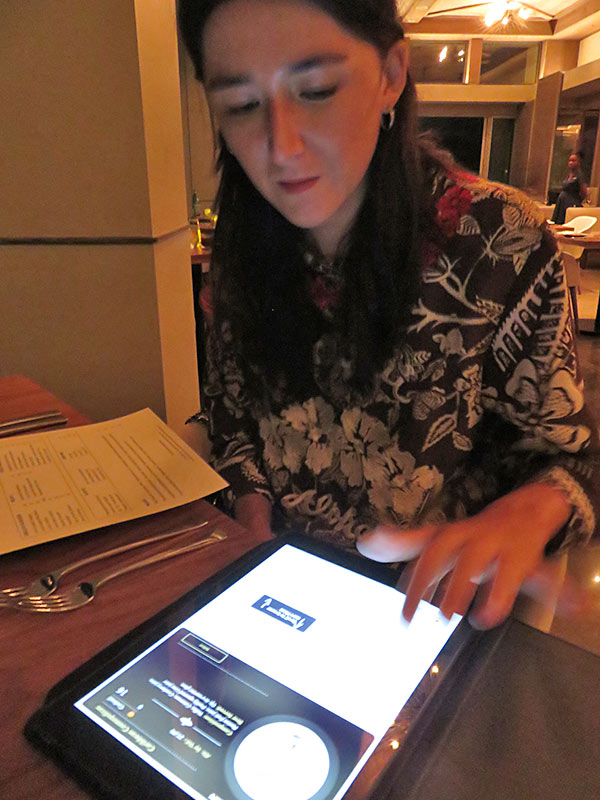 wine selection presented via tablet at coba four seasons