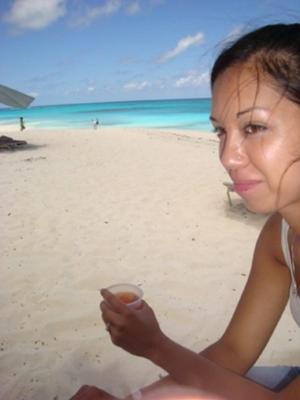 Amber enjoying a rum punch on Shoal Bay beach